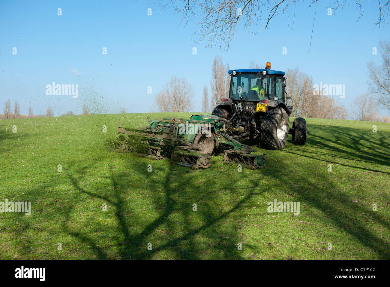 A council tractor cutting the grass in a public park. Stock Photo