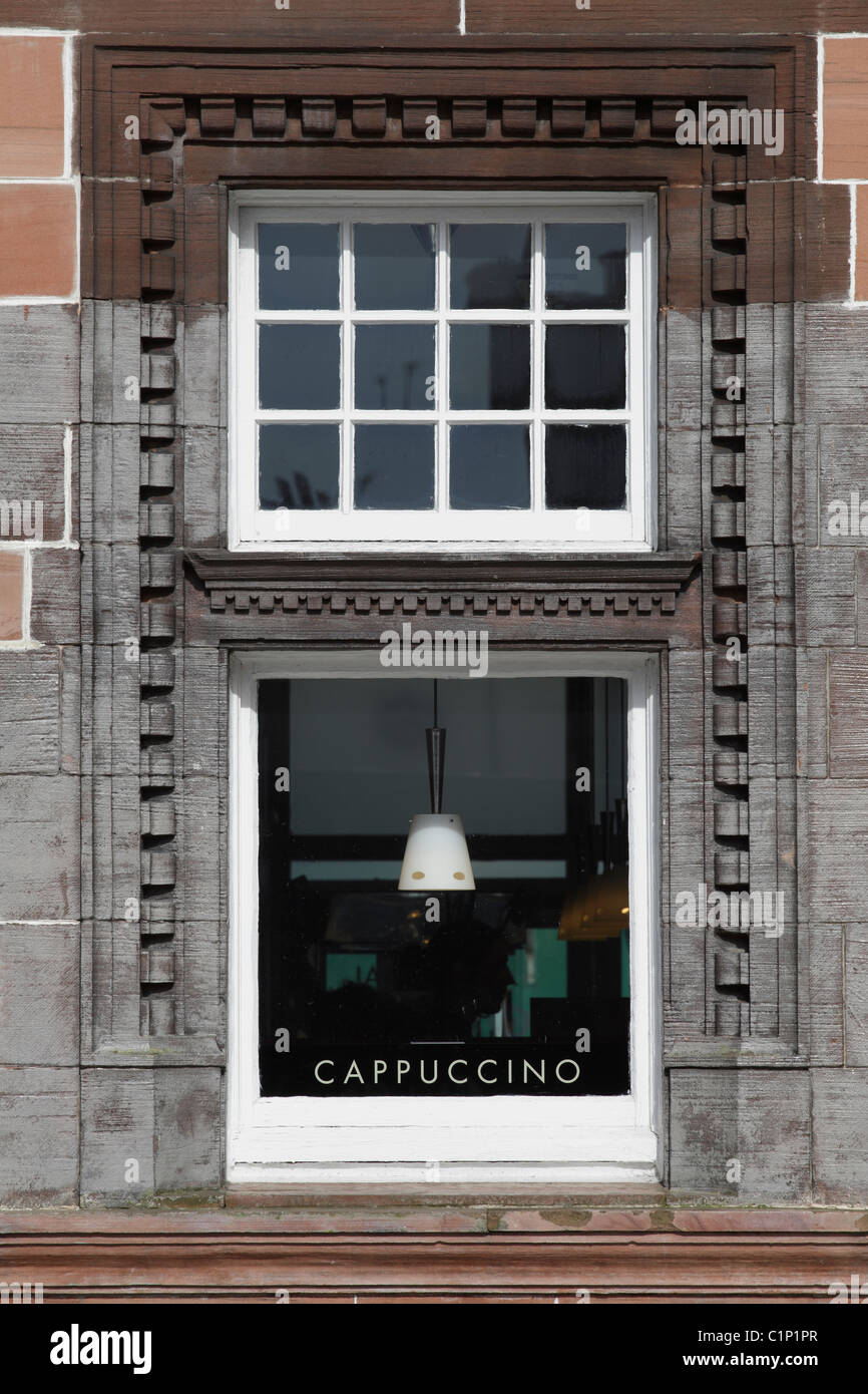 Cafe Nero coffee shop window with a cappuccino sign, UK Stock Photo