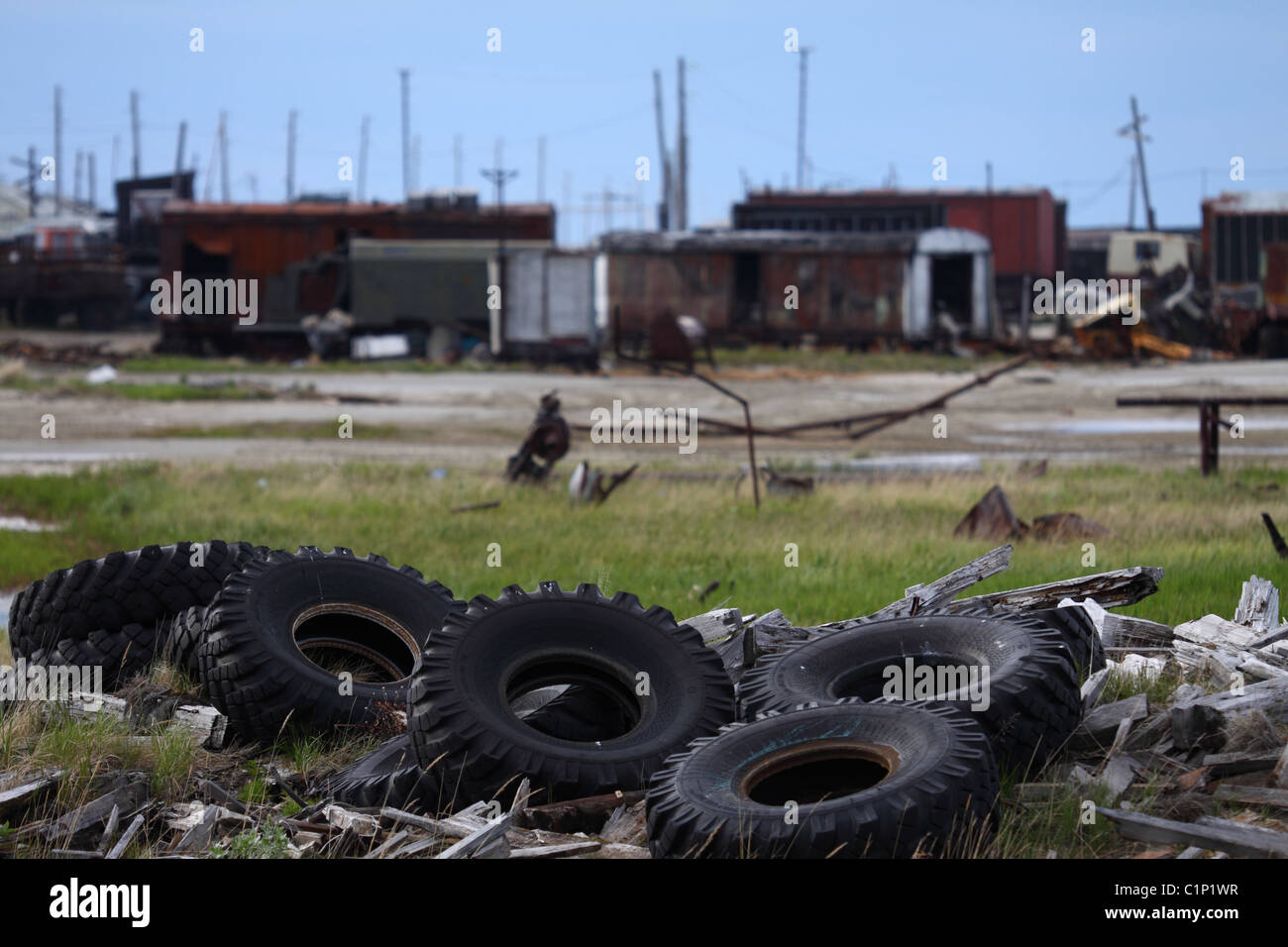 Used tyre dump near settlement Stock Photo