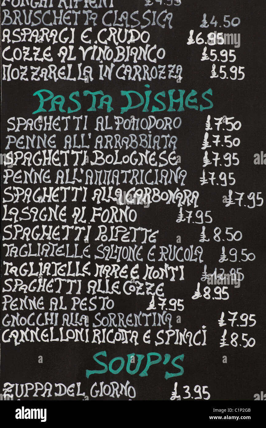 Menu board with handwritten pasta dishes and prices menu outside an Italian Restaurant, UK Stock Photo