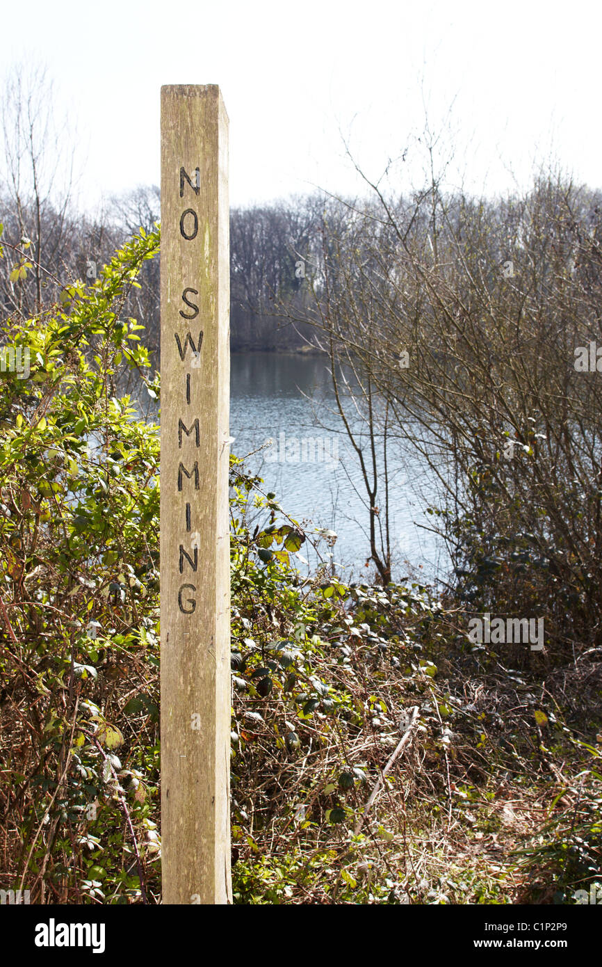 No swimming signs around Heathfield Pond where Alfie Skelton drowned after falling into the water from a dinghy. Stock Photo