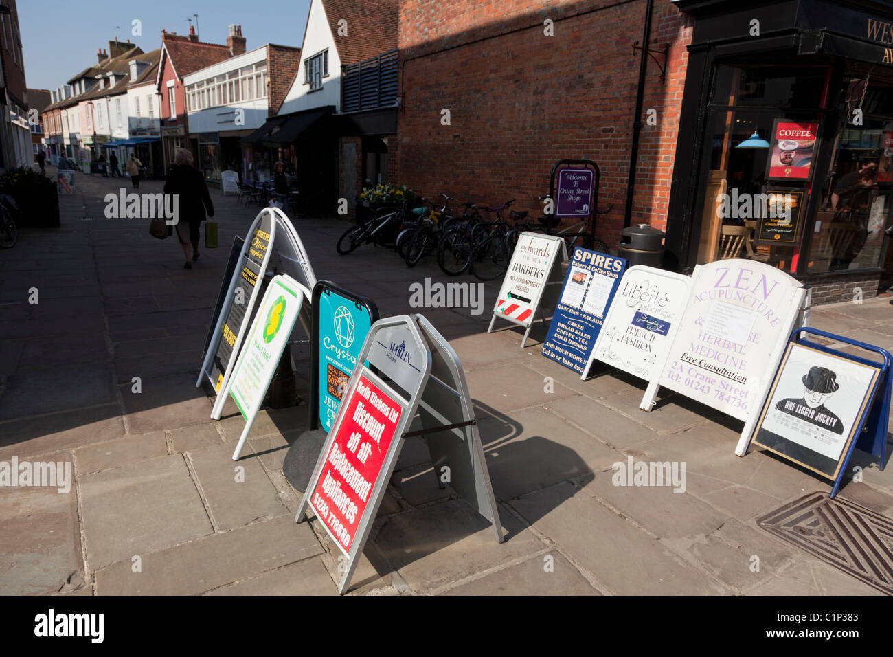 A boards advertising shops  at the end of a shopping street Stock Photo