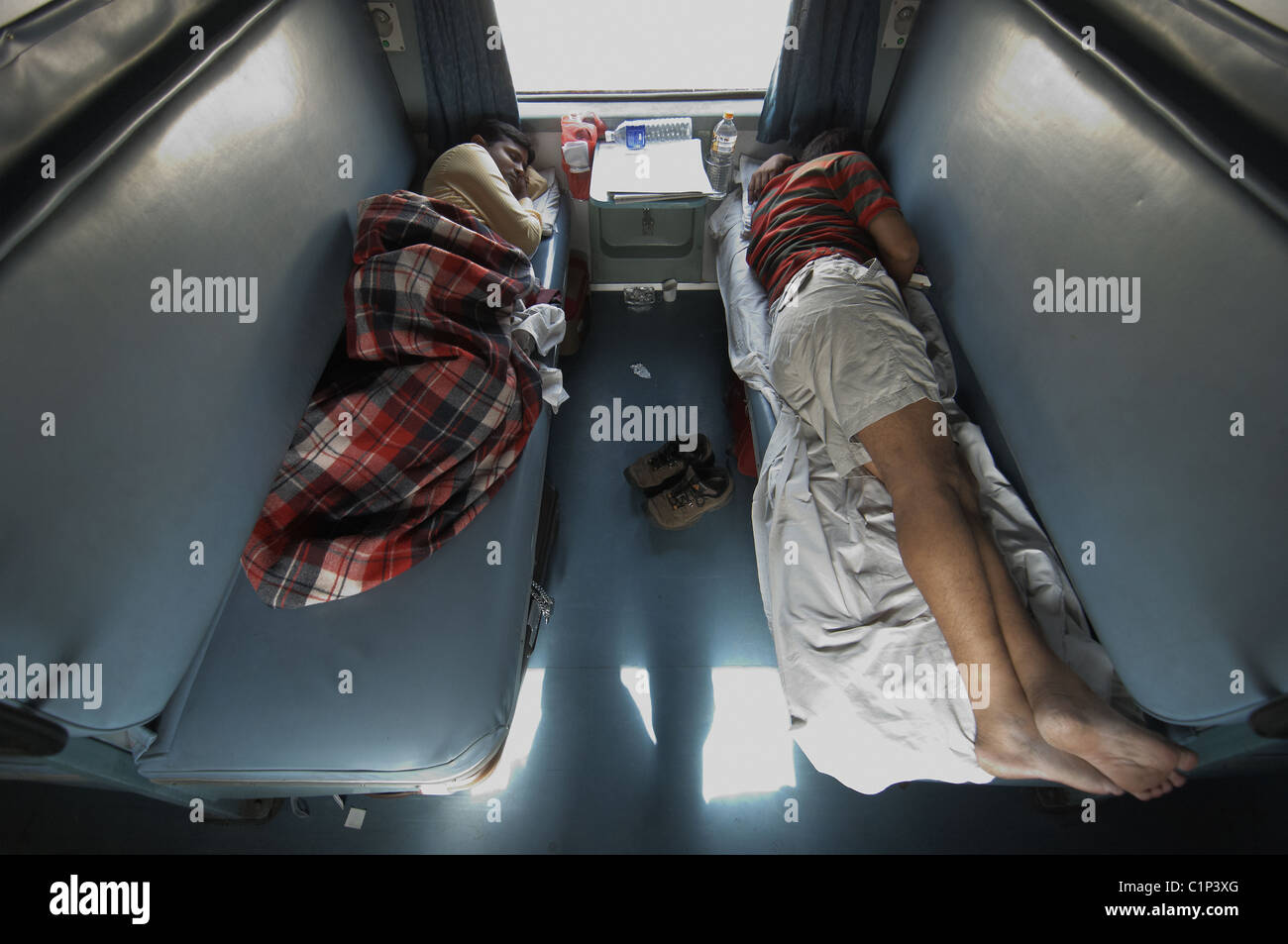 People sleeping on train hi-res stock photography and images - Alamy