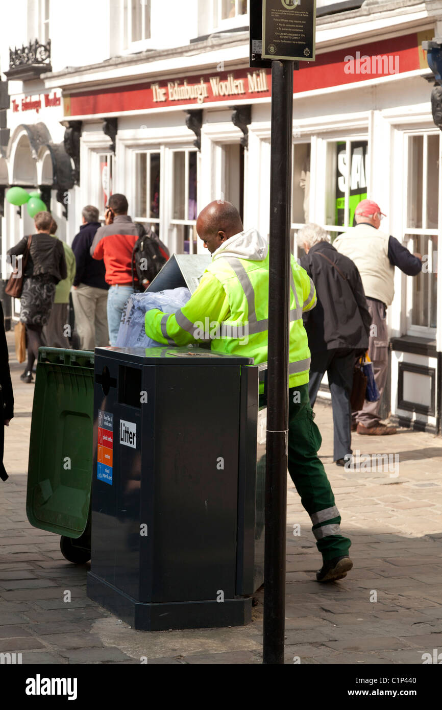street cleaner emptying bins in Chichester City Centre Stock Photo Alamy