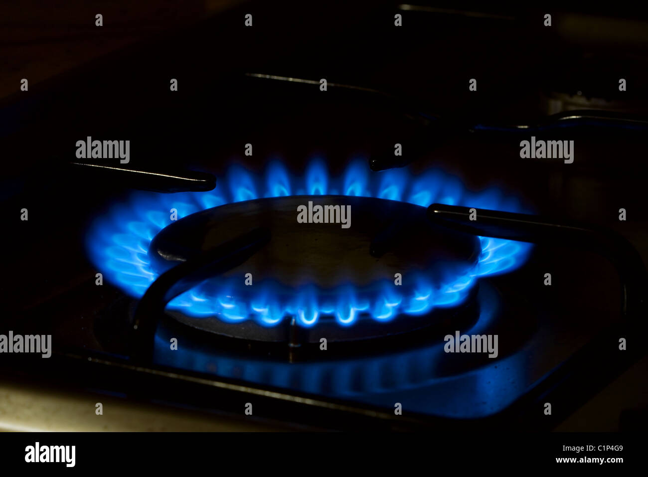 Burner of a stove with blue flame Stock Photo