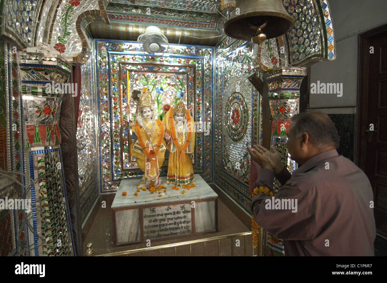 A man prays inside a religious temple in Ludhiana, Punjab, India. Stock Photo