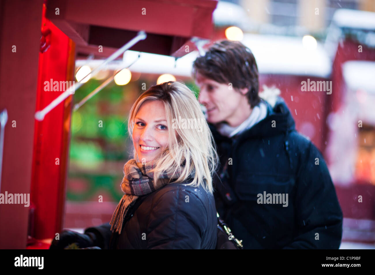 Couple in front of food stall Stock Photo