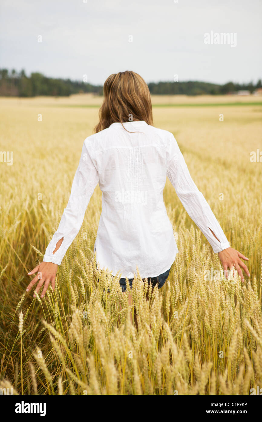 Young woman in wheat field Stock Photo