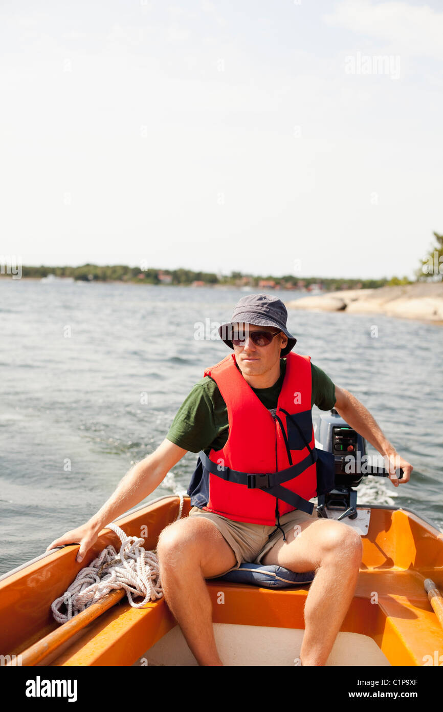 Man riding motorboat Stock Photo