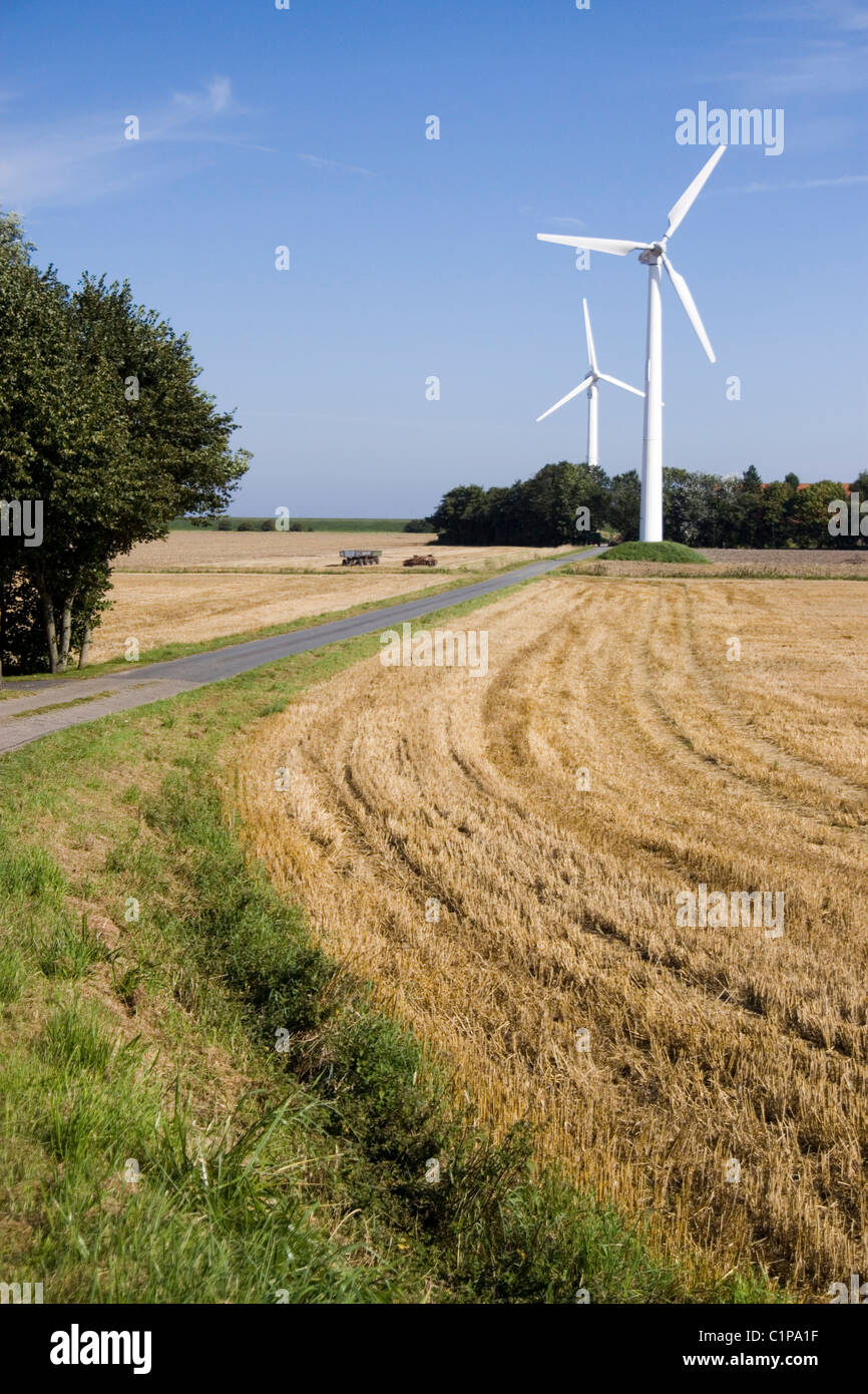 Germany, Ostfriesland, wind turbines in countryside Stock Photo