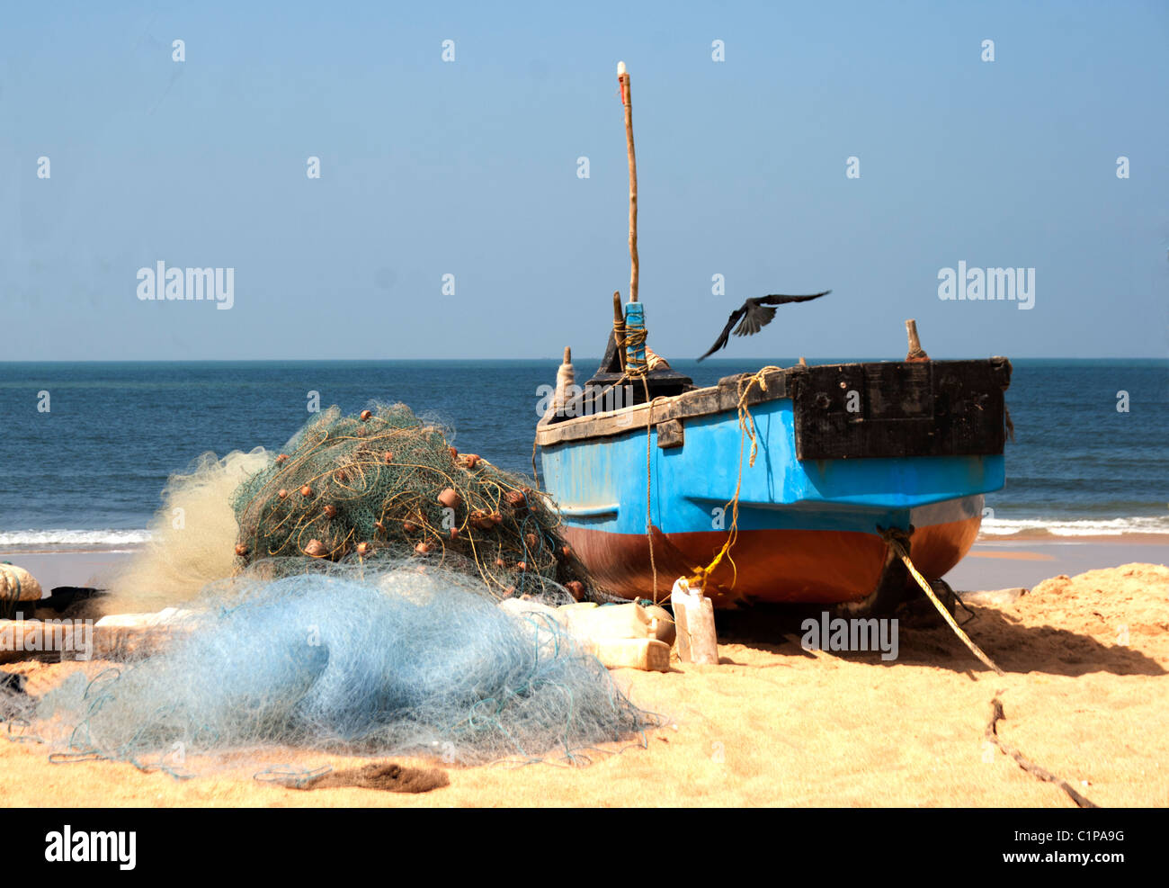 berthed fishing vessels on the beach with nets, copy space Stock Photo