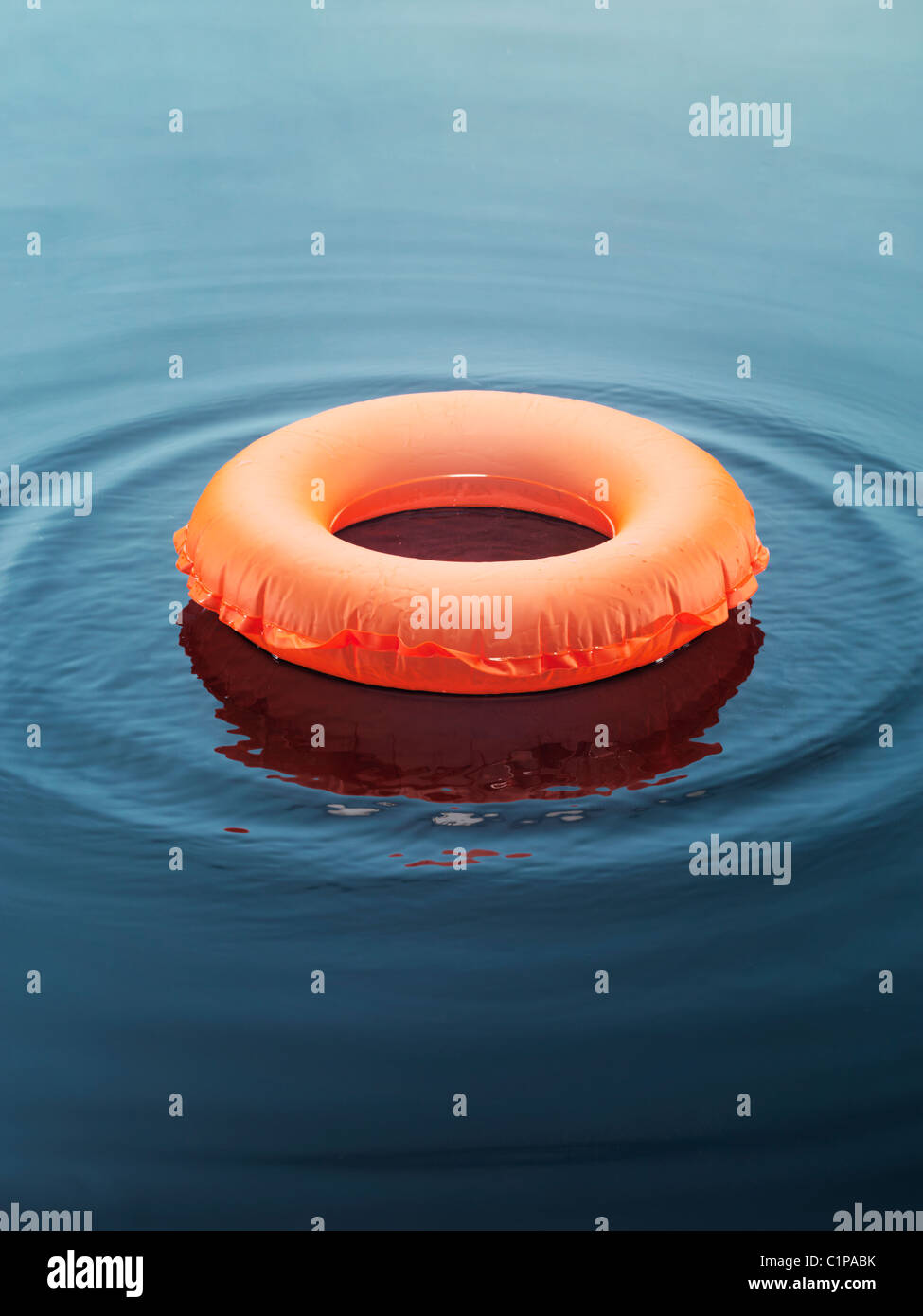 Inflatable ring floating on water Stock Photo