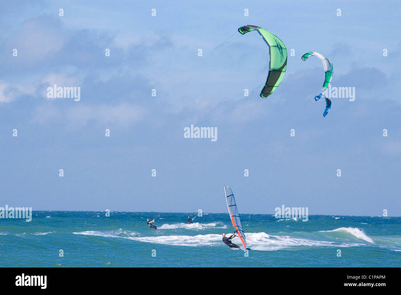 Germany, Sylt, windsurfing and kiteboarding at sea Stock Photo