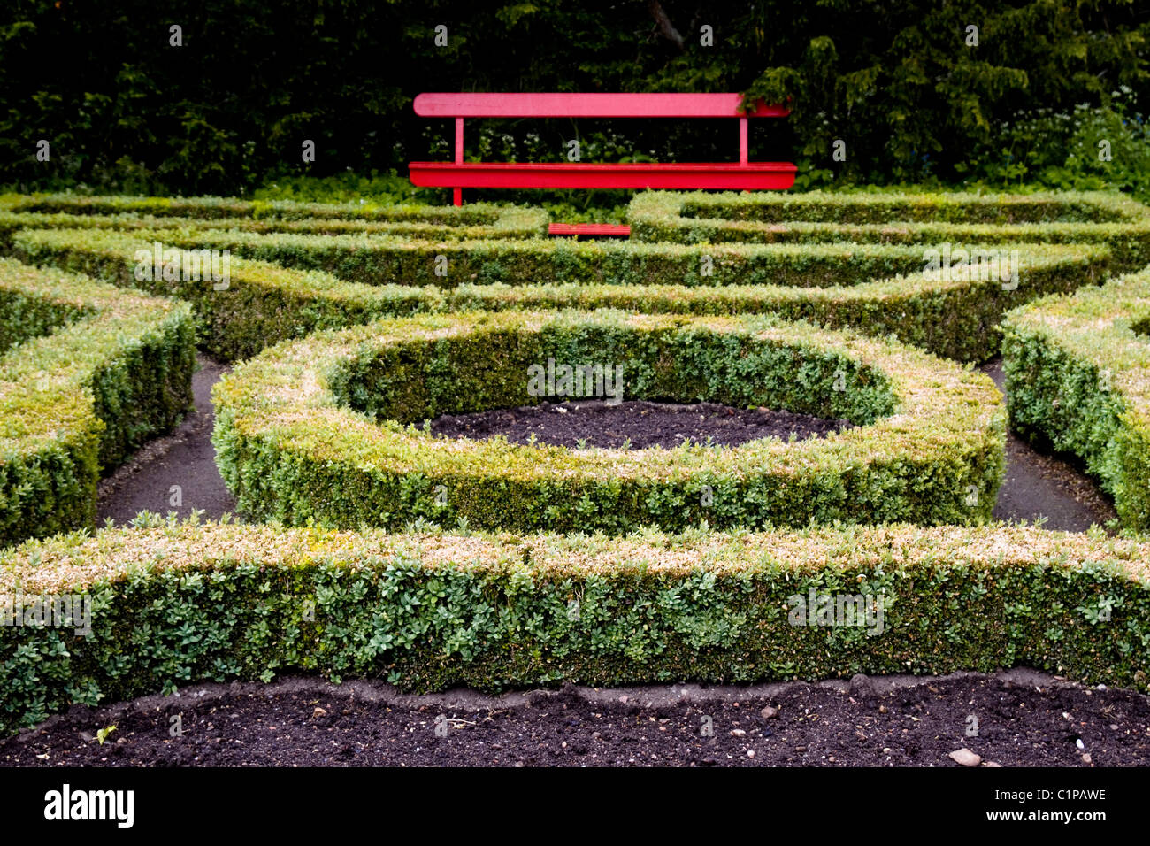 Scotland, Cawdor Castle, hedge maze and garden bench Stock Photo
