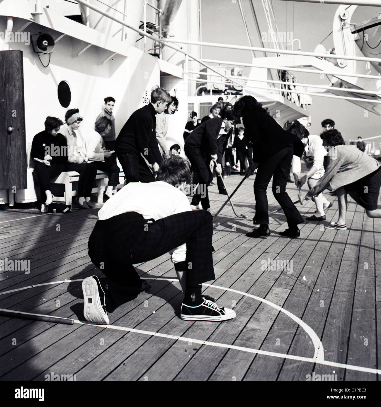 British India cruise liner, 1950s. Passengers playing hockey on the deck of the ship. Stock Photo
