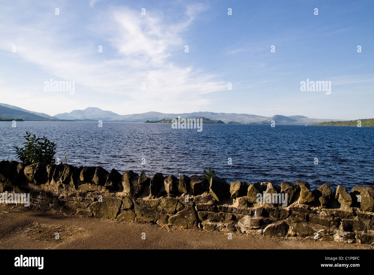 Scotland, Loch Lomond, wall at water's edge Stock Photo
