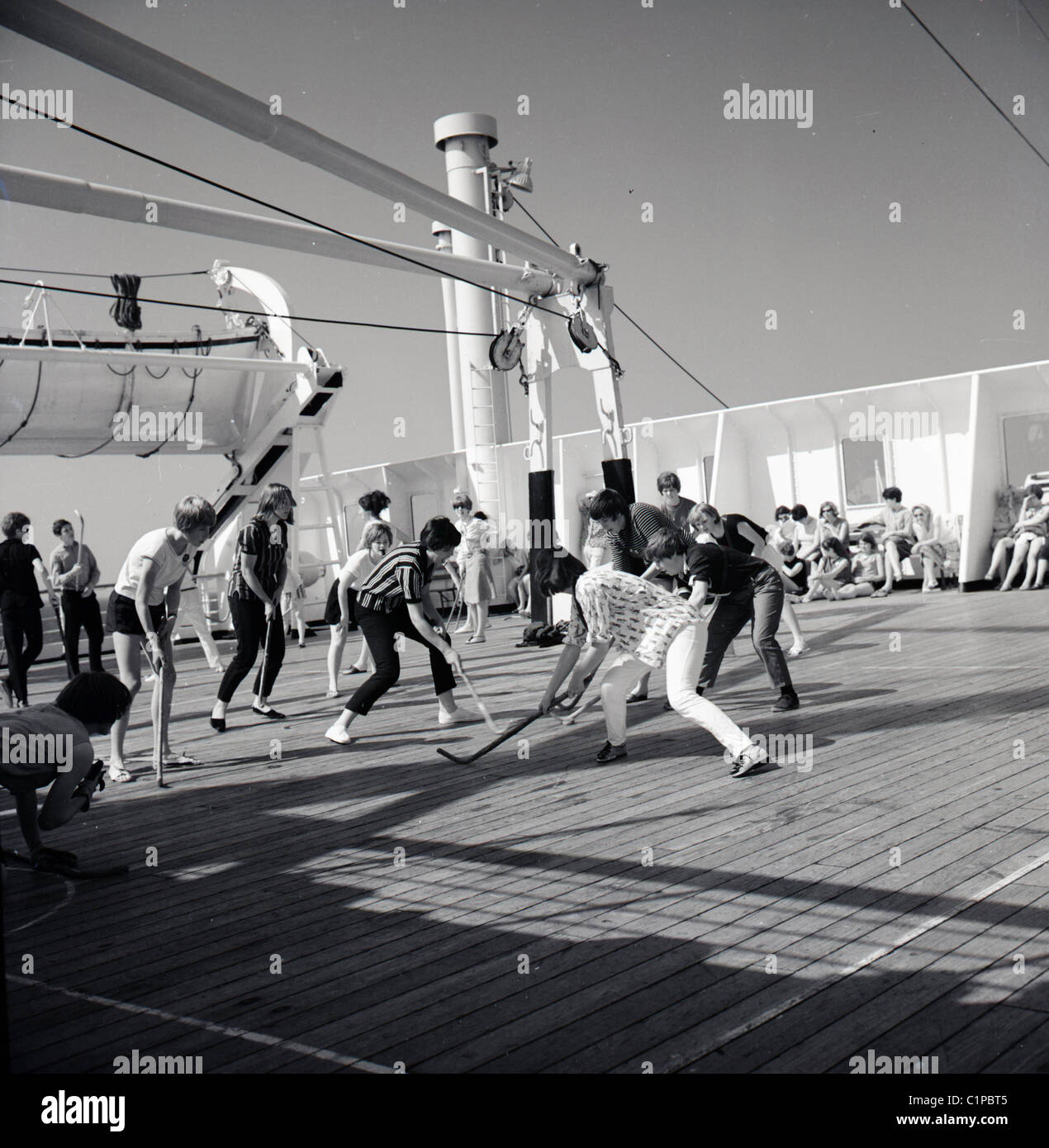 British India cruise liner, 1950s. Passengers playing hockey on the deck of the ship. Stock Photo