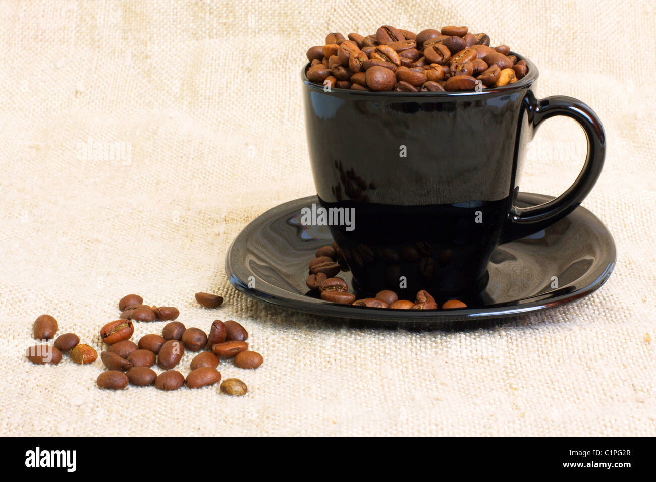 Mug with coffee beans Stock Photo Alamy