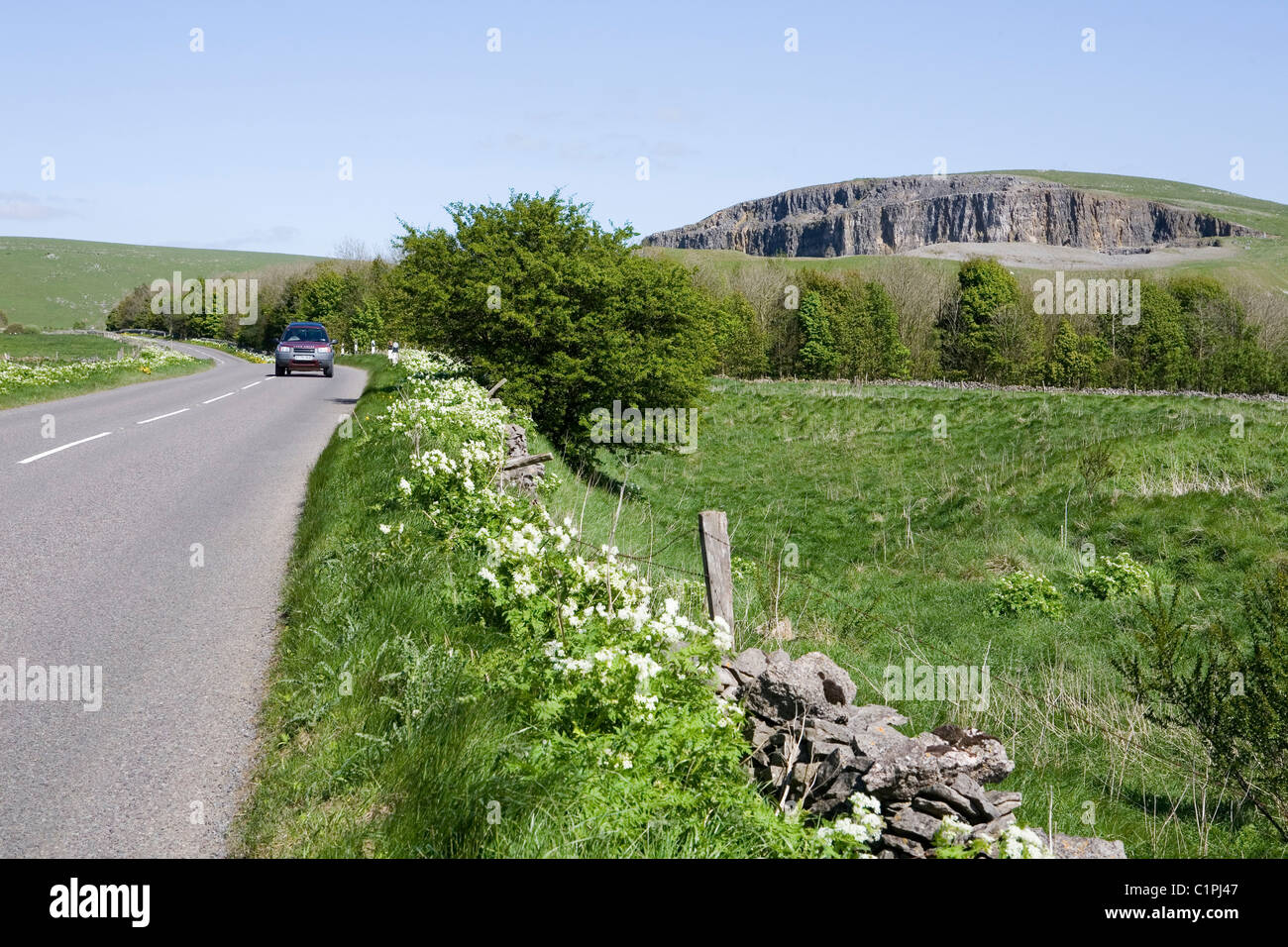 England, Derbyshire, Winnats Pass, car on road in Peak District National Park Stock Photo