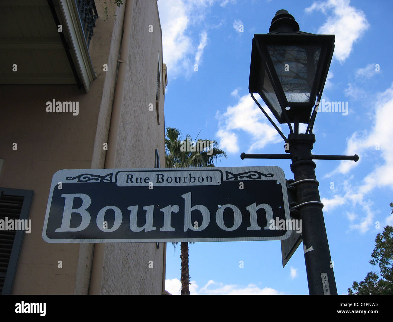 Close-up view of street sign on old lamp post, New Orleans, Louisiana