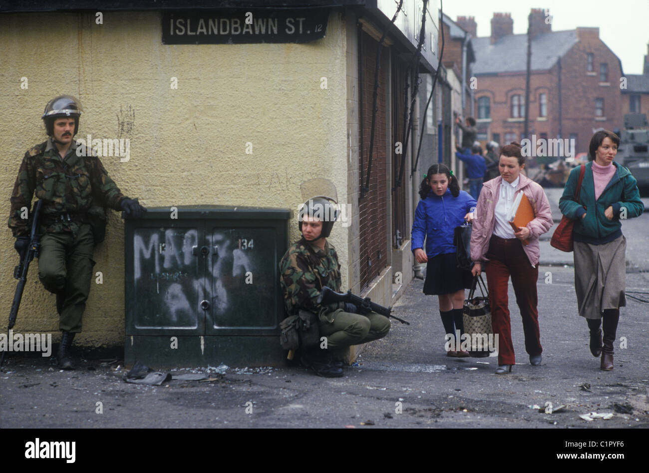 Belfast The Troubles 1980s. Islandbawn Street, Falls Road Belfast British soldiers. 1981 People there daily life  UK HOMER SYKES Stock Photo