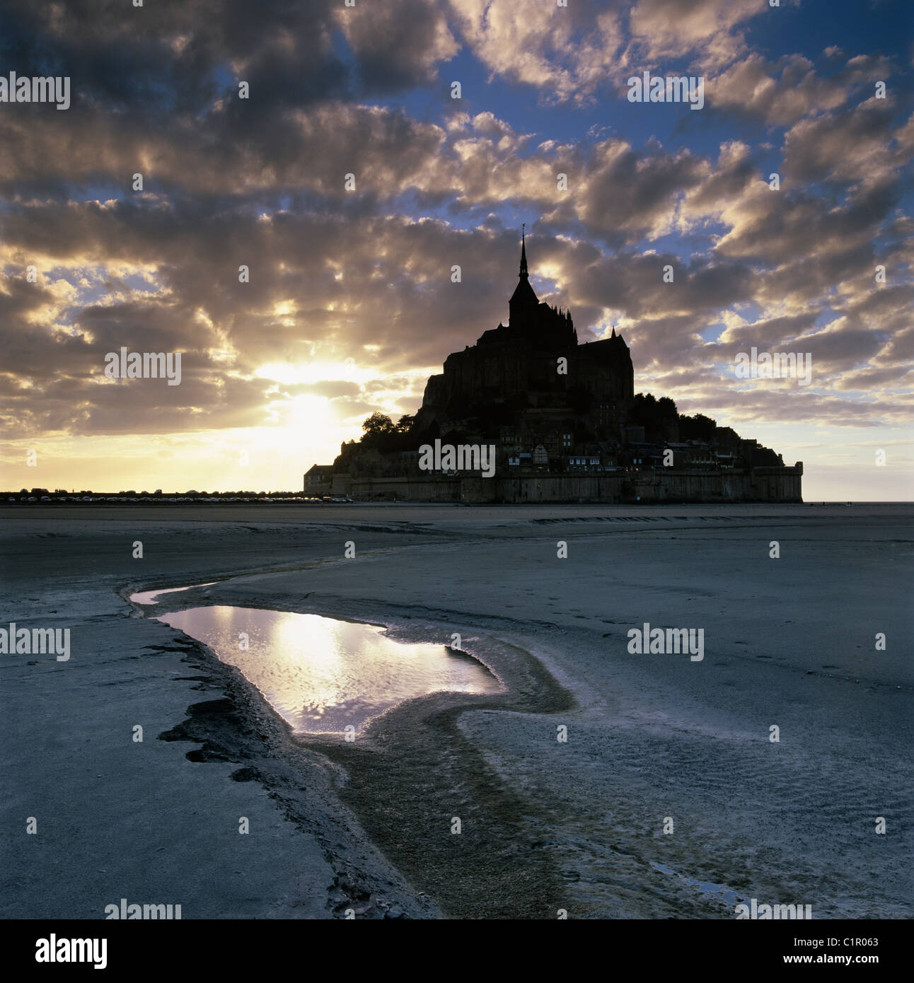 Sunset over Abbey and mud flats Stock Photo