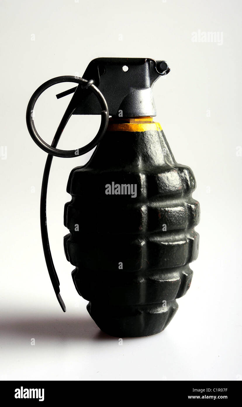 A fregmentation grenade under harsh side lighting to emphasize its shape and contours. Stock Photo
