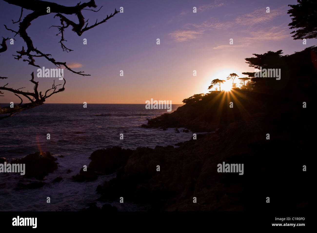 Last glimpse of sun to end the day along the 17 mile drive, Monterey Bay, Central California, USA Stock Photo
