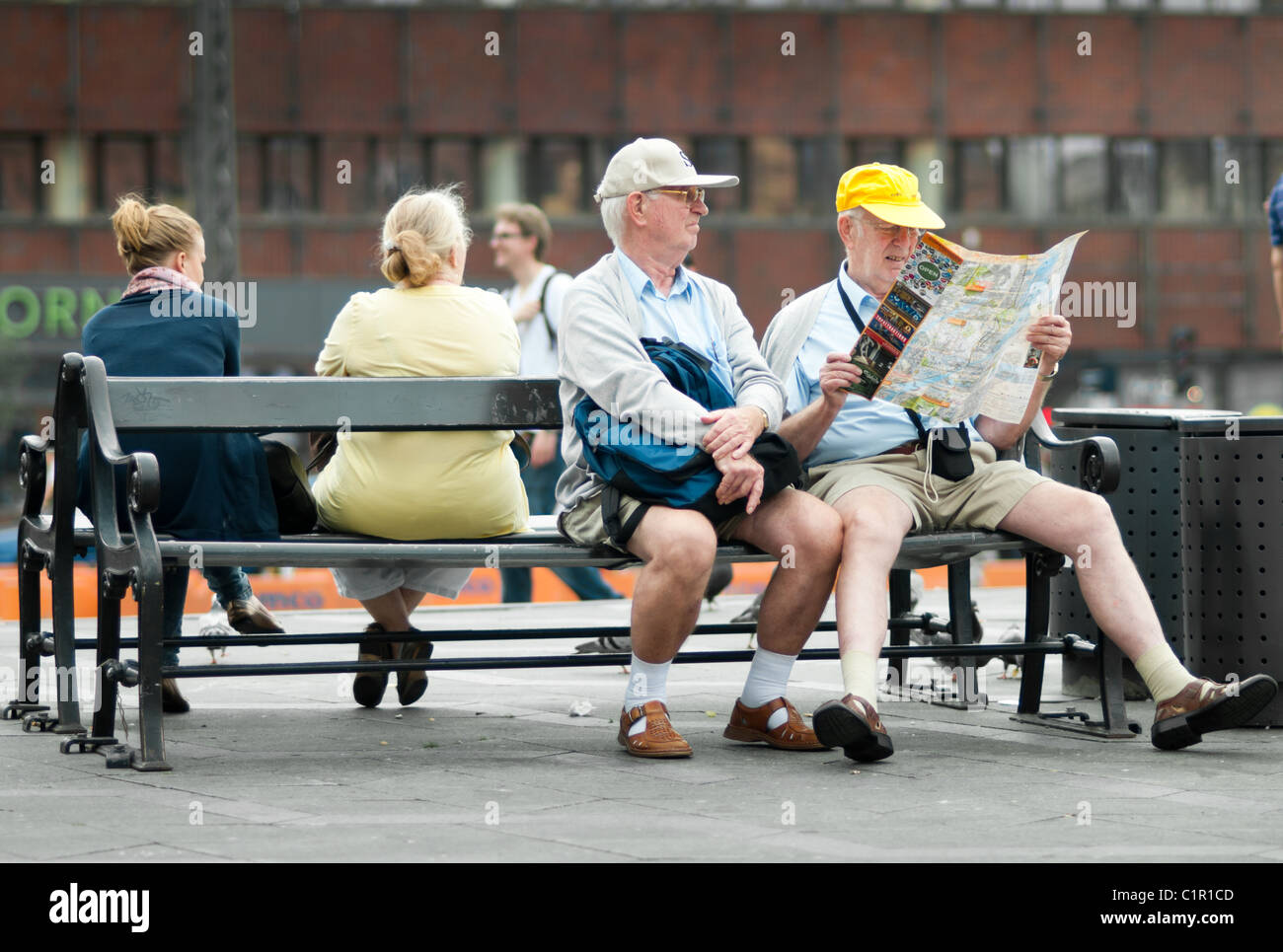 Retired people siting on a bench in Copenhagen Stock Photo