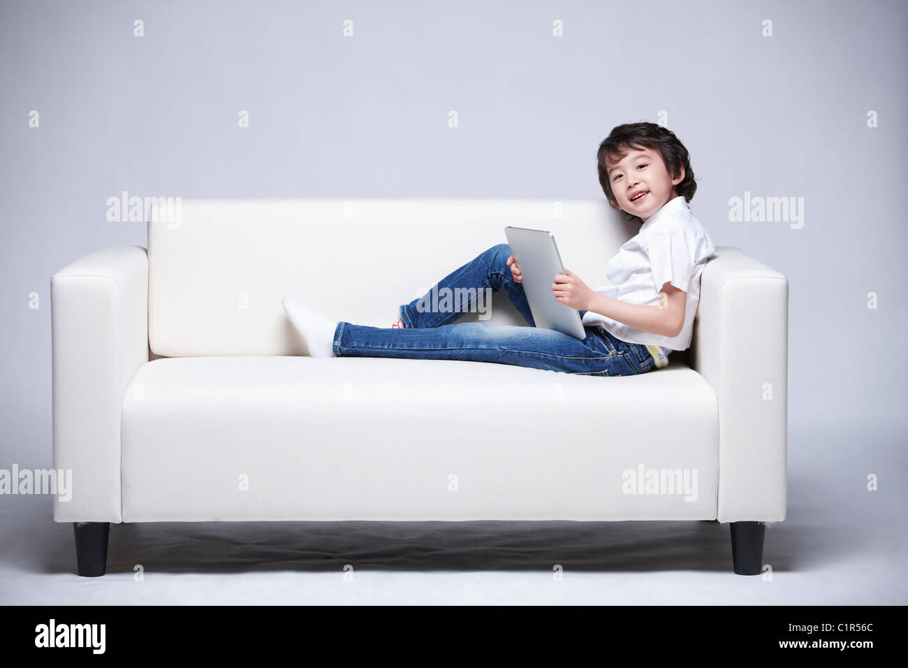 children education boy using tablet pc Stock Photo - Alamy