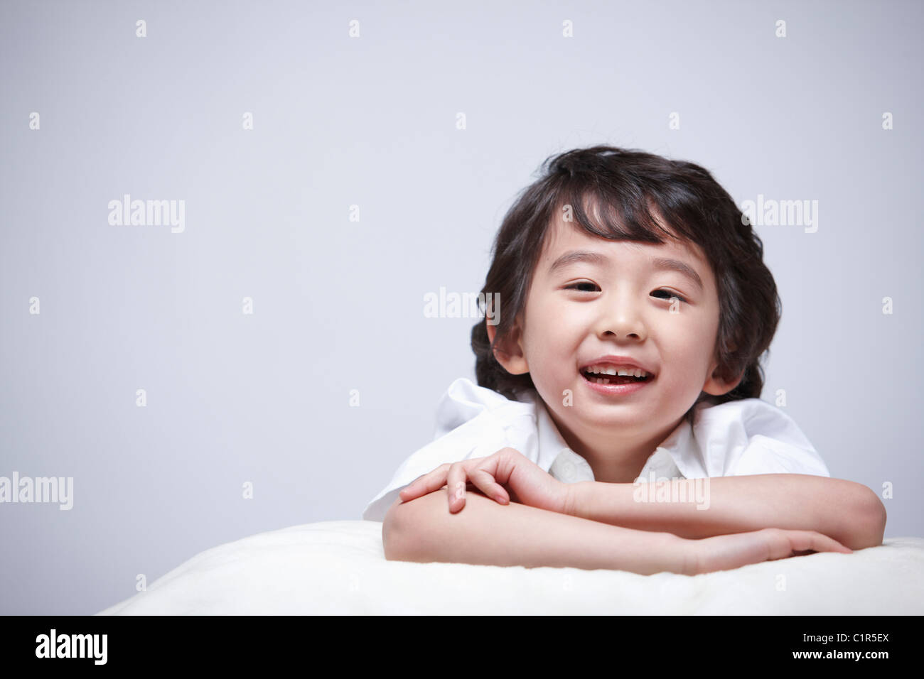 children education boy lay face down on the pillow Stock Photo Alamy