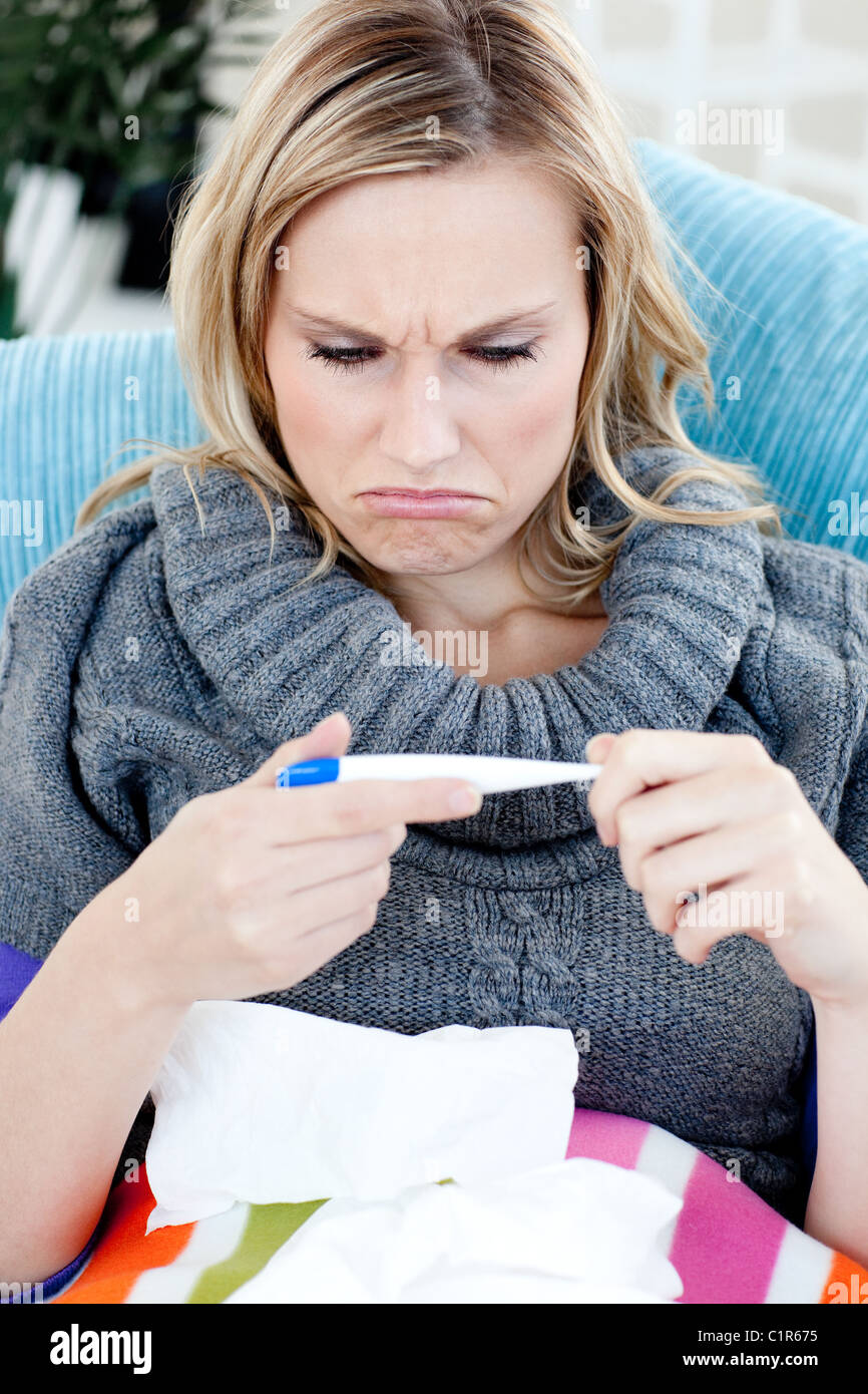 Diseased woman with a thermometer Stock Photo