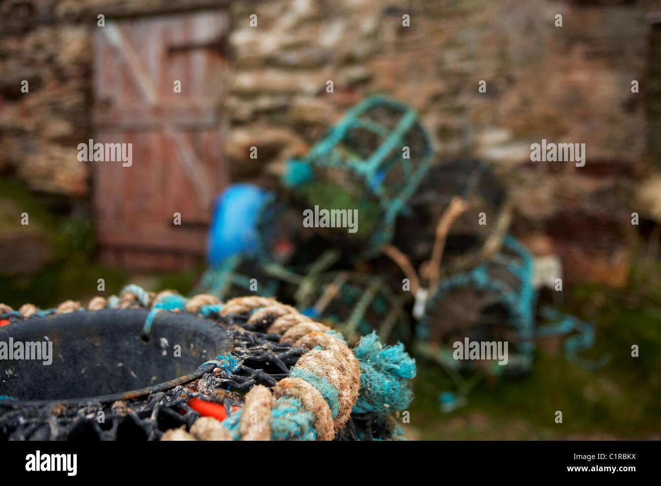 Lobster pots on the quayside at Hope Cove on the South Devon coast UK
