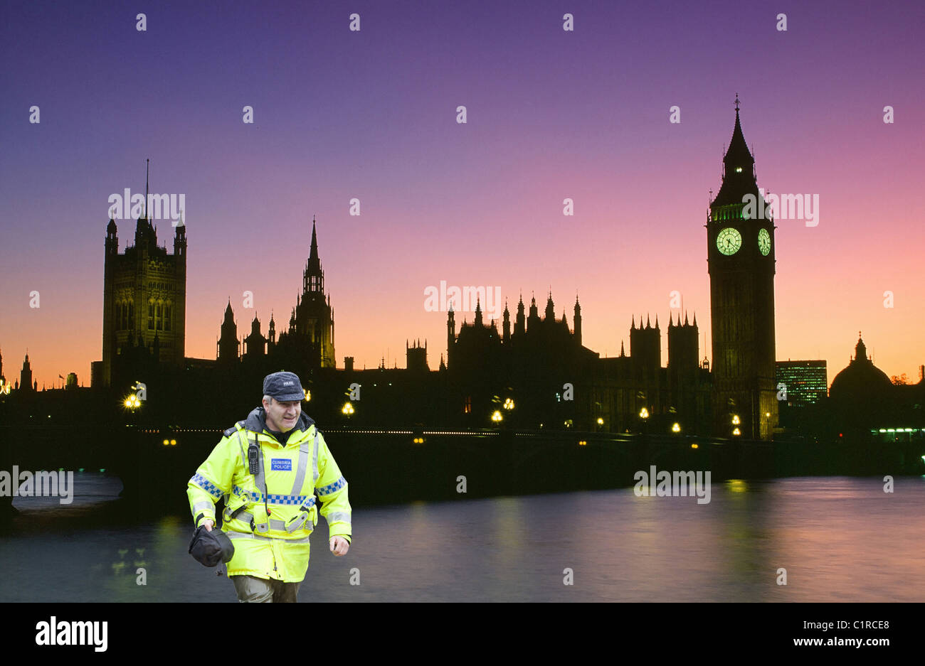 Big Ben and Houses of Parliament in London at dusk UK, with a policeman ...