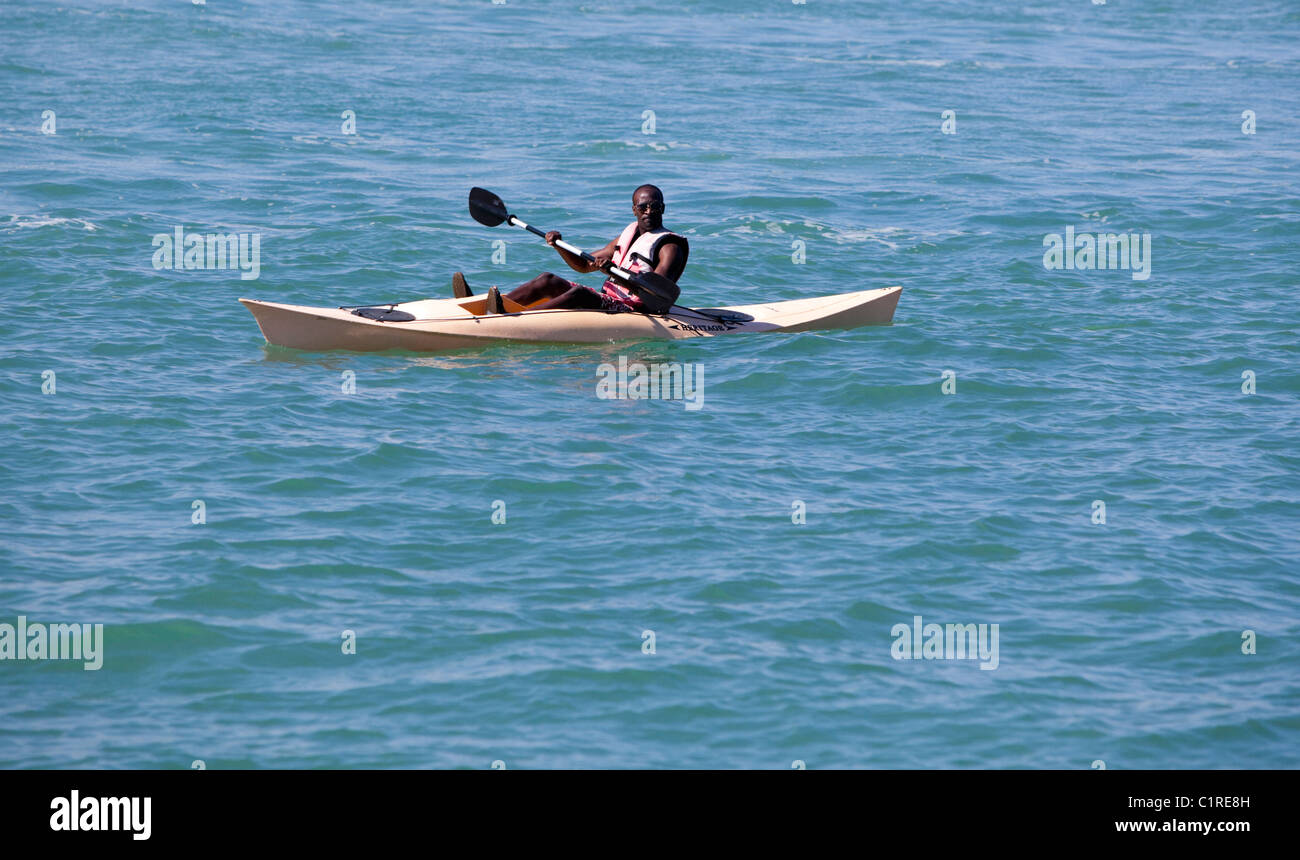 Black man kayaking in the sea, Miami, Florida, USA Stock Photo