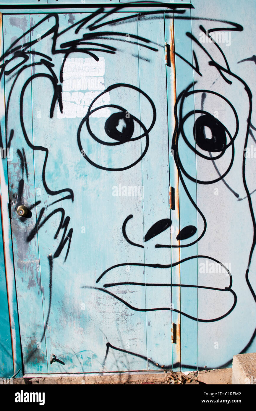 Graffiti on a shed door in Mescalero, New Mexico Stock Photo