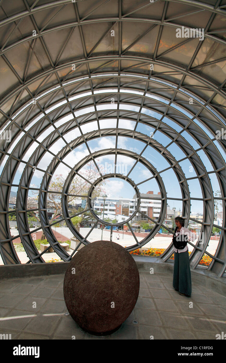 A pre-columbian stone sphere is displayed in a spherical building outside the Museo Nacional de Costa Rica in San Jose Stock Photo