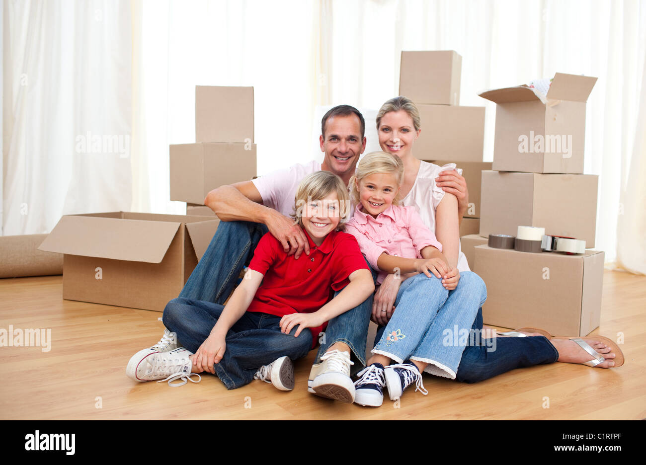 Tired family relaxing moving house hi-res stock photography and images ...