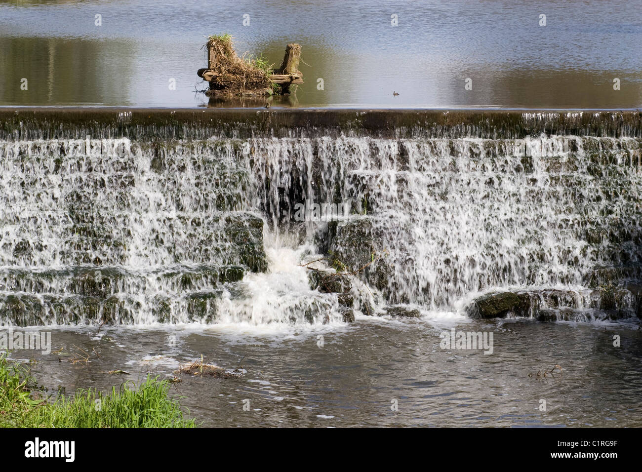 Weir from country house pool Stock Photo