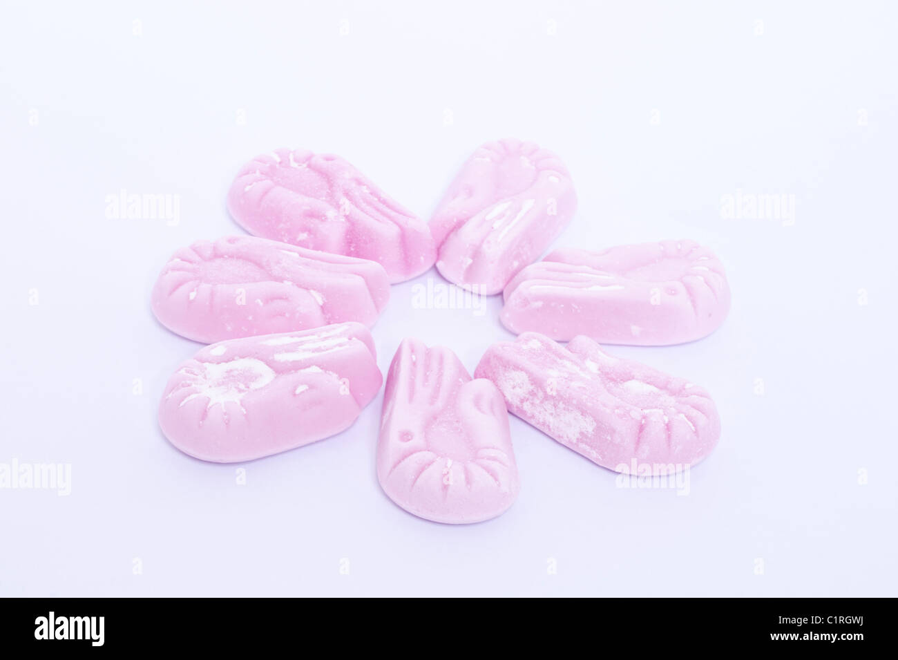 A selection of raspberry flavour shrimps traditional sweets on a white background Stock Photo