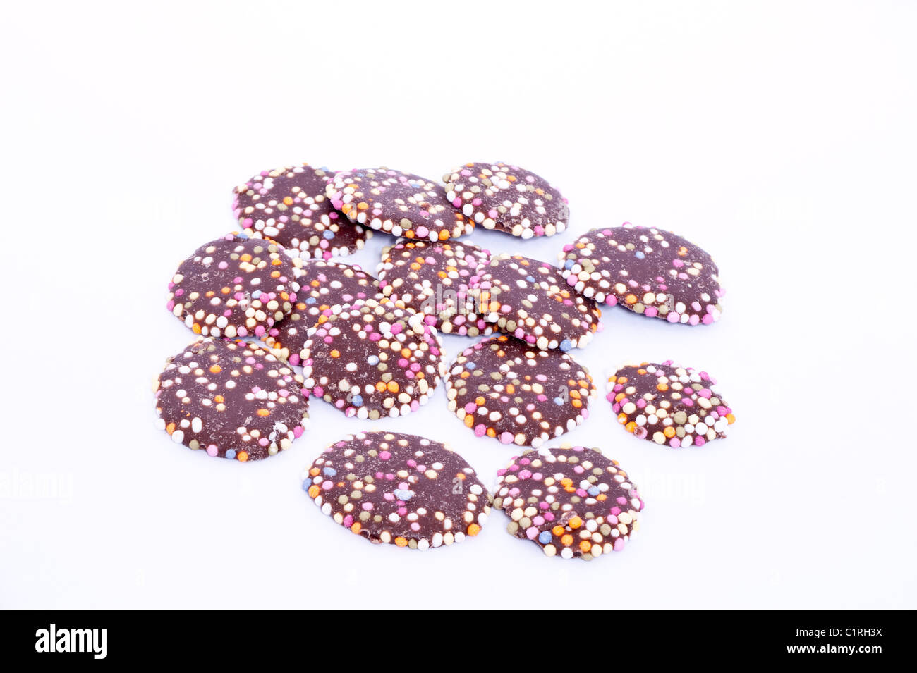 A selection of milk chocolate jazzies traditional sweets on a white background Stock Photo