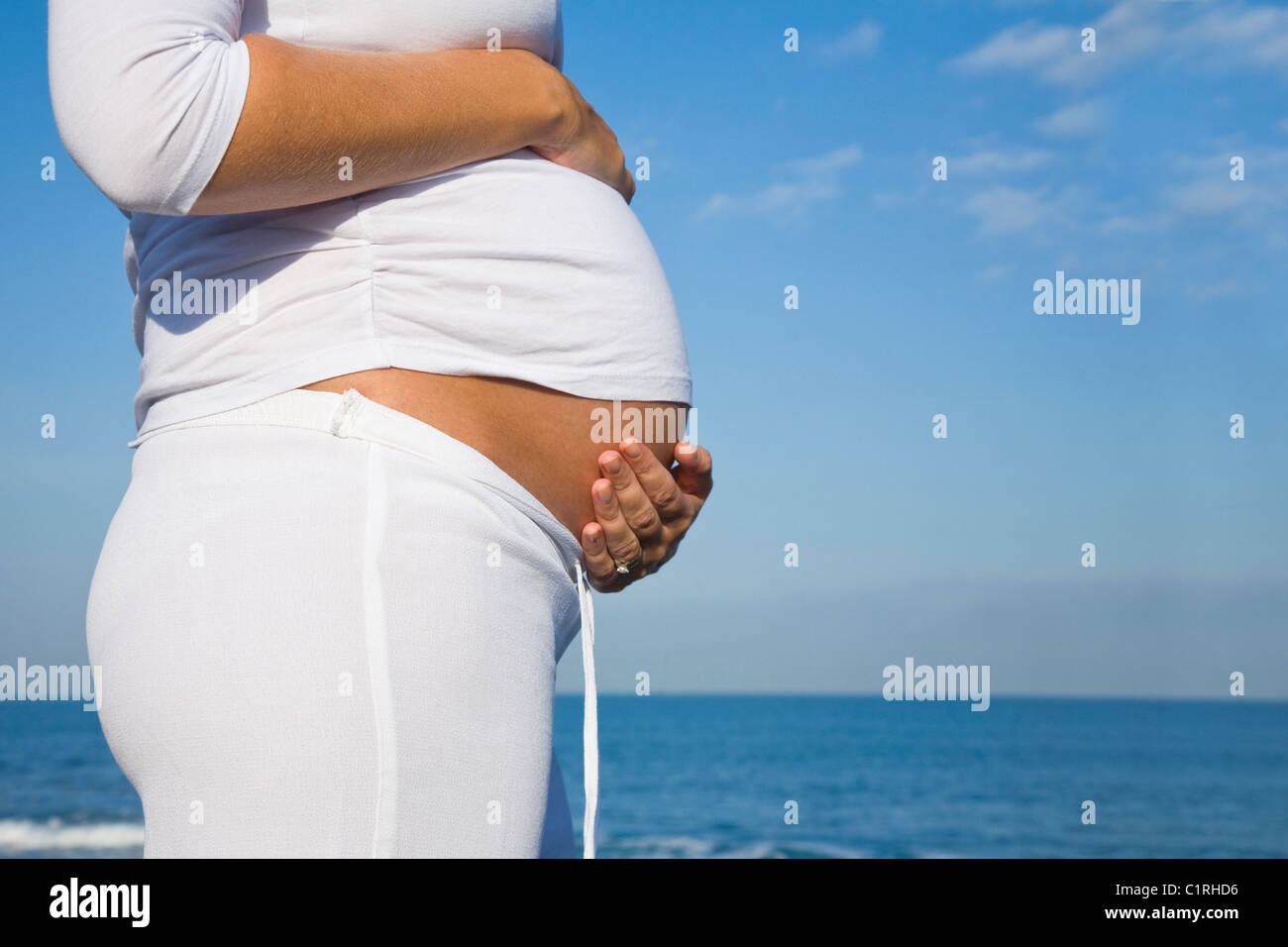Pregnant woman standing in sea hi-res stock photography and images - Alamy