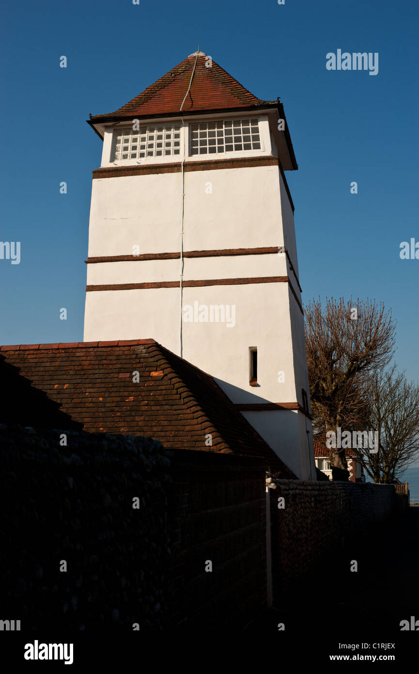 The Overstrand Clock Tower is part of the part of the stable block of The Pleasaunce, as seen from the Londs. Stock Photo