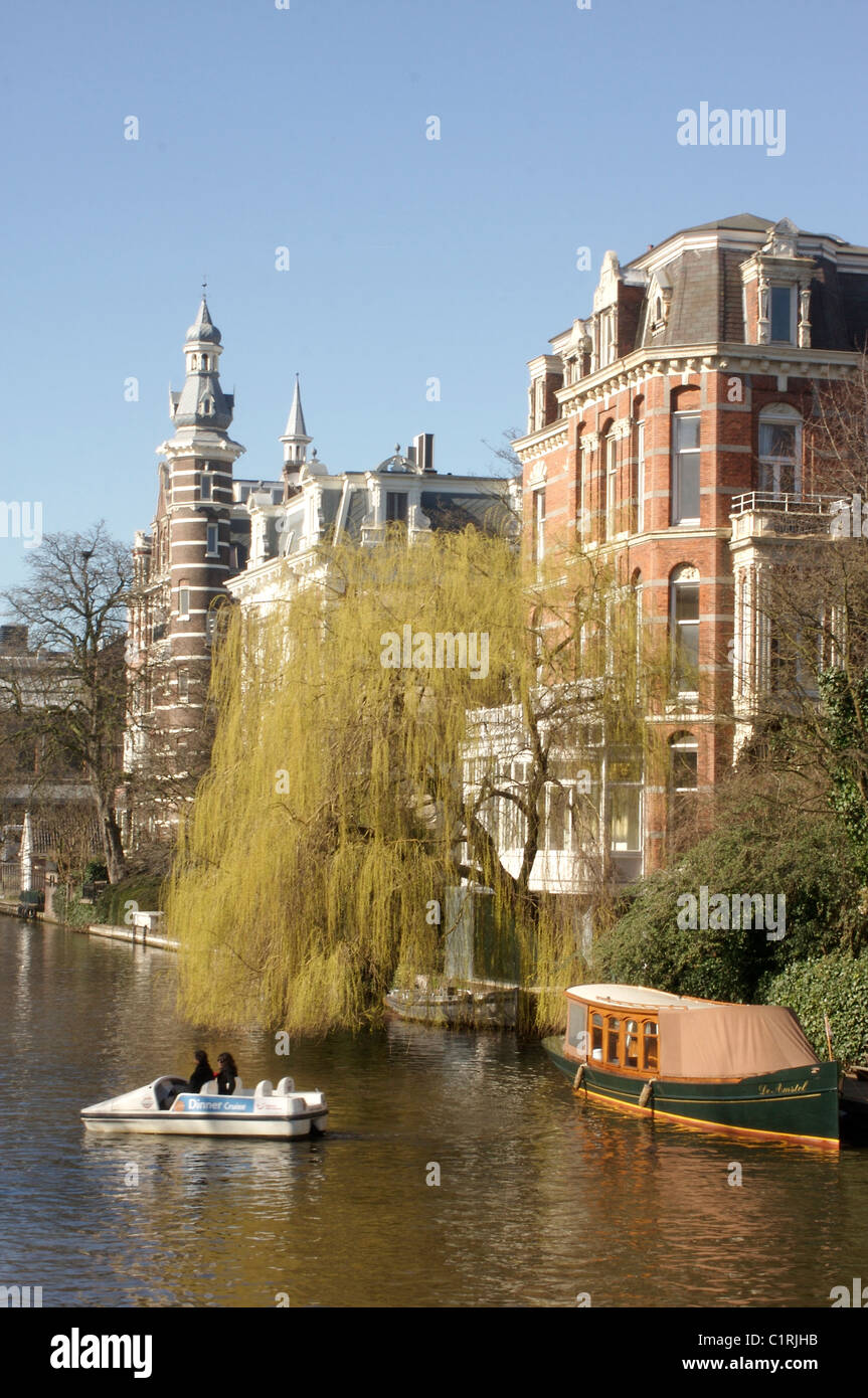 Pedal boating along the canals of Amsterdam, Holland Stock Photo Alamy