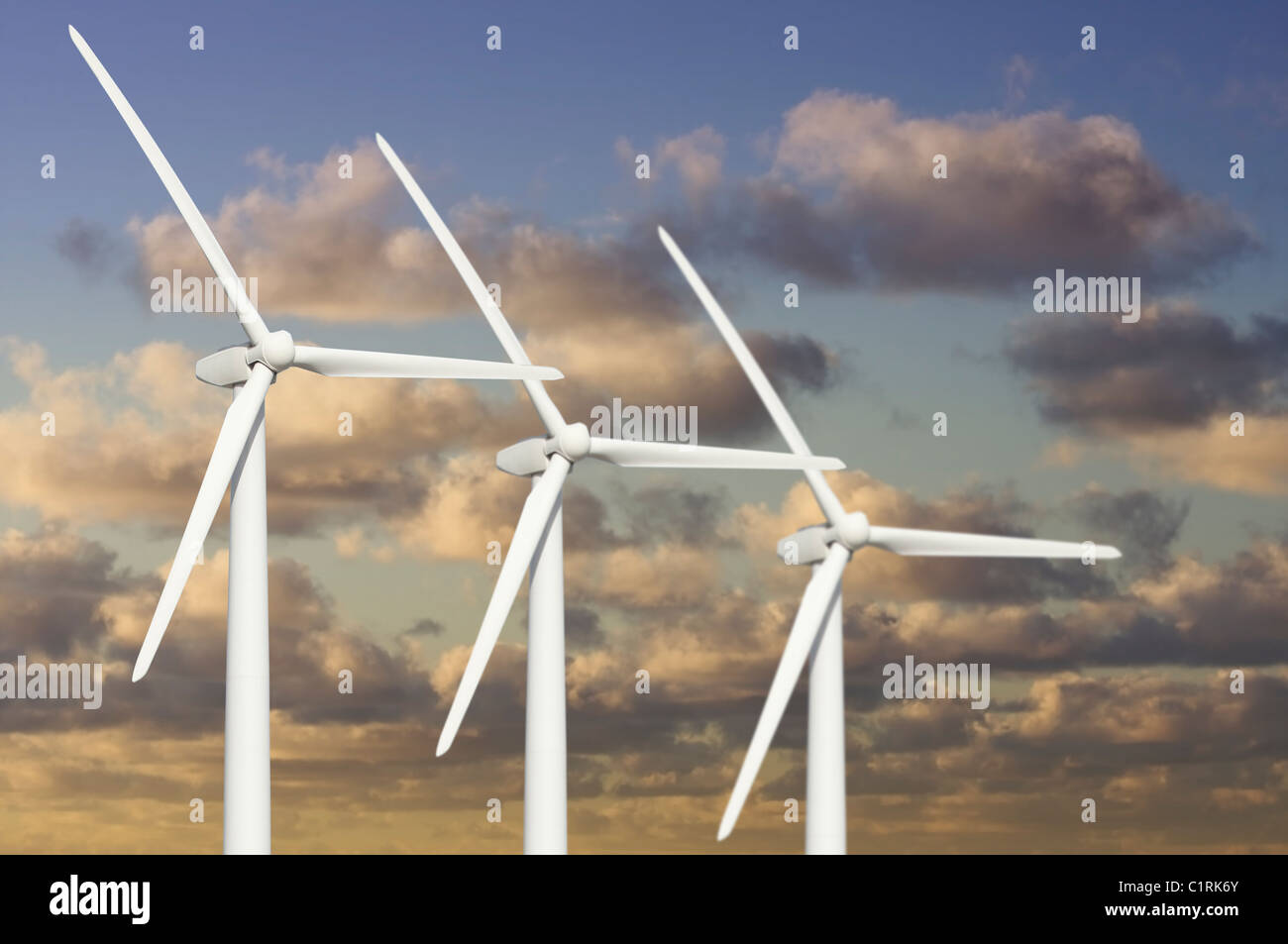 Three Wind Turbines Over Dramatic Blue Sky and Clouds Stock Photo - Alamy