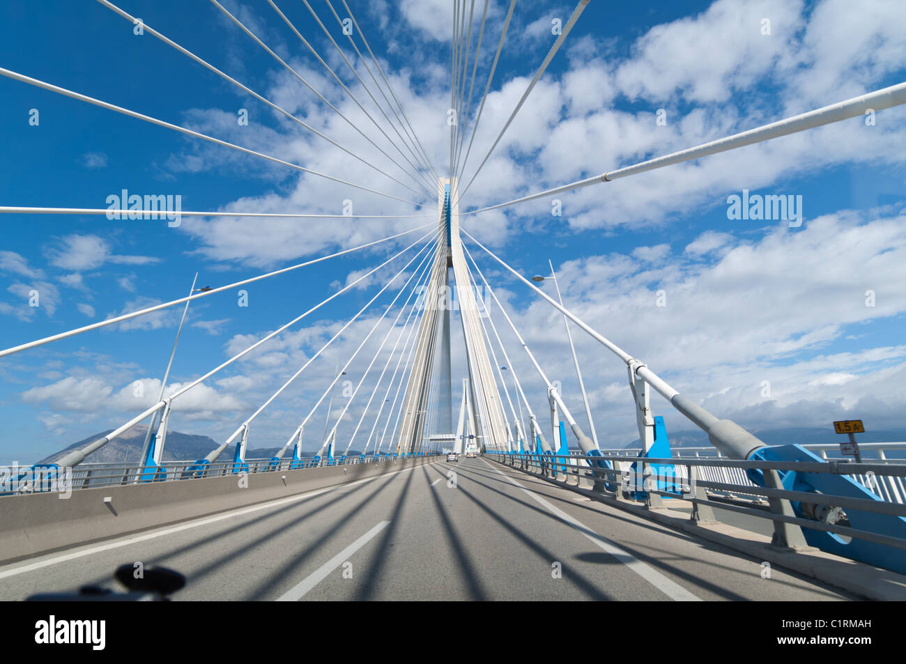 Supporting cables provide a dramatic perspective when crossing the Rio-Antirion  Bridge near Patra, Greece. Stock Photo