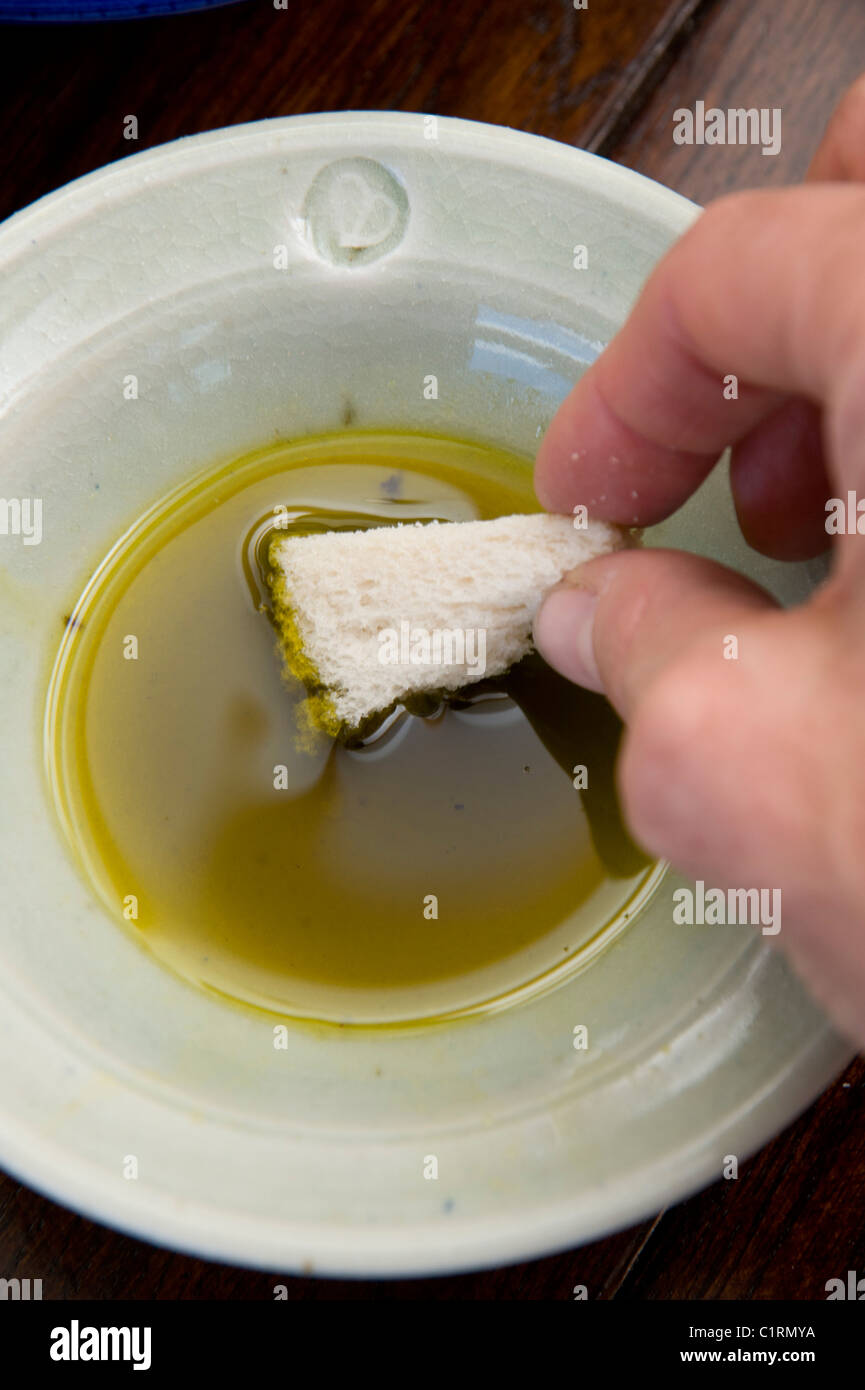 Handshot Of Dipping Bread Into Olive Oil Stock Photo Alamy Handshot Of Dipping Bread Into Olive Oil Stock Photo Alamy