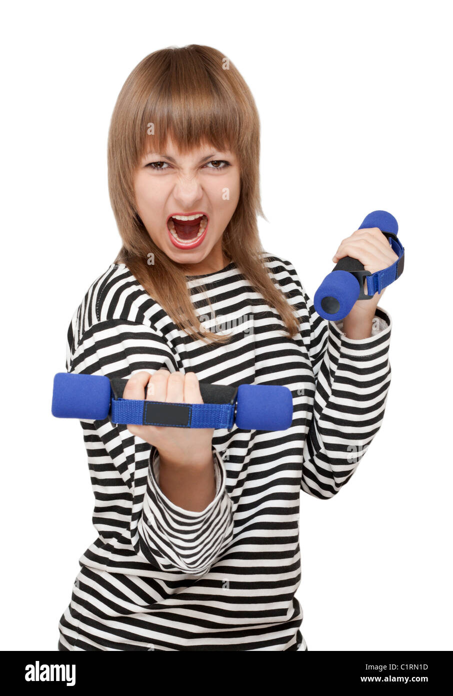 Young girl with dumbbell yells on white background Stock Photo