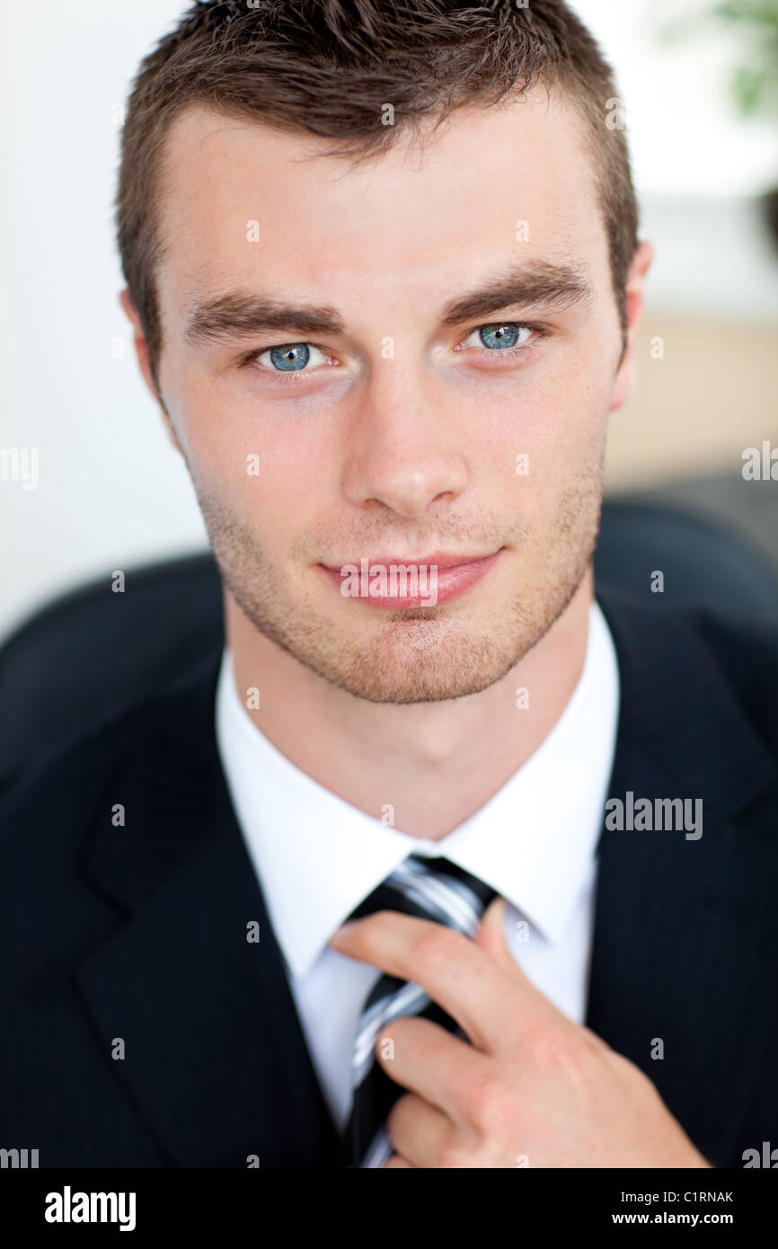 Attractive businessman smiling at camera Stock Photo - Alamy