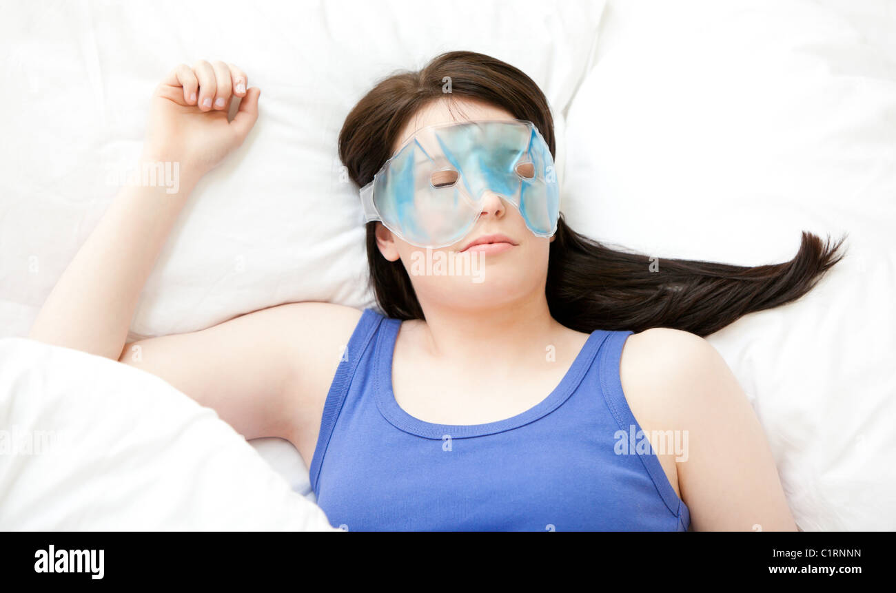 Young woman sleeping with an eye mask Stock Photo Alamy